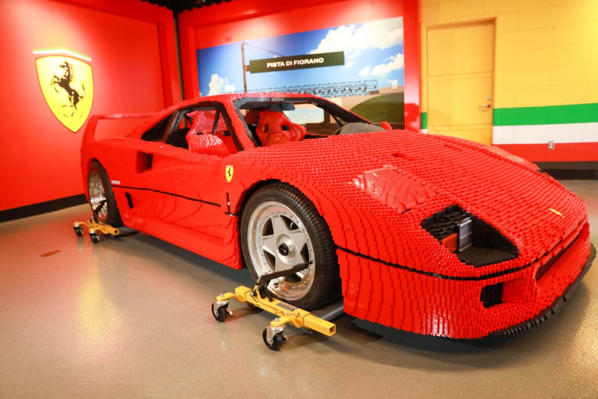 This one-of-a-kind life-size Lego Ferrari is set to go on display at LEGOLAND in California. The red Ferrari F40 car is made out of more than 358,000 Lego pieces and weighs more than 3,000 pounds. It took a team of designers and builders more than 1,800 hours to develop and more than 1,900 hours to construct the high-performance ultra-luxury sports car. Resembling the actual F40 Ferrari, the toy brick version is similar in size at 14 feet in length, more than six feet wide, 4 feet tall and a wheelbase at 8 feet. Visitors can enjoy it as part of the resort's new attraction, LEGO Ferrari Build and Race, opening on May 12, 2022 at the Carlsbad theme park. The model will be featured in the garage area. "Future builders, drivers and enthusiasts will get a chance to sit inside, take pictures and most of all, be inspired by the life-size LEGO vehicle," a spokesperson said. The garage is one of three interactive zones which also includes the build and test area, and digital racetrack for guests to digitally race their own LEGO Ferrari against other cars for the fastest lap. The new attraction places guests in the driver's seat as they use their creativity and imagination to build, test and race. Editorial usage. Credit Courtesy of LEGOLAND California Resort/MEGA. 28 Apr 2022 Pictured: The Ferrari goes on display. Photo credit: LEGOLAND California Resort/MEGA TheMegaAgency.com +1 888 505 6342 (Mega Agency TagID: MEGA852104_007.jpg) [Photo via Mega Agency]