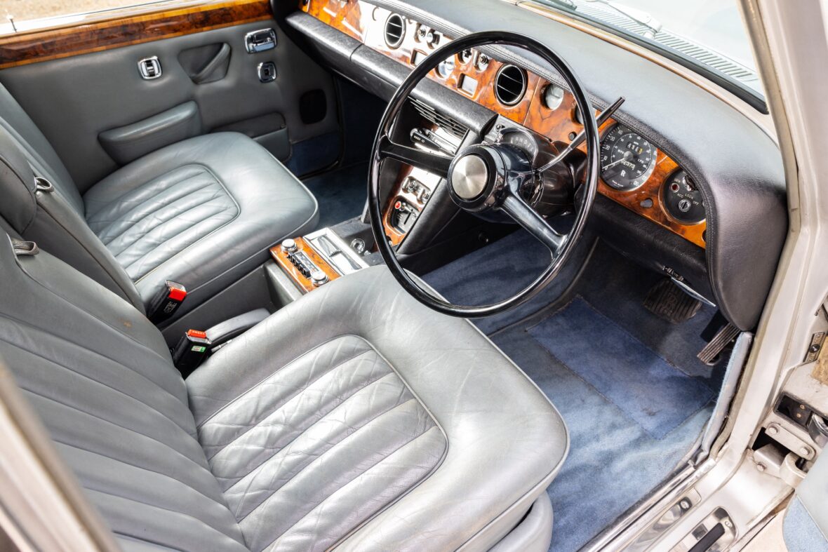 Freddie Mercury’s 1974 Rolls-Royce Silver Shadow is set to hit the auction block next month. The Queen frontman bought the luxury car in 1979 - despite not having a driving license. It is finished in a "factory-correct colour pairing of Silver Chalice over Blue", according to auction house RM Sotheby's and is powered by a 6,750 cc V-8 engine. Mercury owned the car until his death in 1991 at the age of 45. It's thought he used it as his "personal chauffeur-driven transport" at the height of his and Queen's fame. Features include a car phone and a cassette deck. The car, which has a pre-sale estimate of between £20,000 GBP and £30,000 GBP, is being sold with paperwork, which has Mercury’s name on it, and includes paperwork recorded in the name of Mary Austin — Mercury’s former partner, who assisted the singer with upkeep of the Rolls-Royce. A letter from ex band manager Jim Beach further verifies the car’s celebrity ownership. It reads in part: "We filmed the promo video for ‘We Will Rock You’ in the garden of [drummer] Roger Taylor’s new Surrey mansion … and Freddie upstaged everyone by arriving in his brand-new Roller. "Freddie insisted that we sign all of the (EMI/Elektra) contracts, all of us together, in the back of the Roller because this was the first Rolls he’d ever owned." Beach notes that upon Mercury’s death in November 1991, the Silver Shadow continued to be driven by the rockstar’s sister, Kashmira Cooke, who subsequently bought the car from the Freddie Mercury Estate in 2003. The Rolls-Royce was enjoyed for many years by Ms Cooke and her partner until it was bought at auction by its consigning owner in 2013. Proceeds from the auction, on November 5 in London, will go towards Richard Branson’s supported charity Superhumans Center. It provides aid for war victims in Ukraine and will be used to fund a new hospital in the Ukrainian city of Lviv. "Buyers should note that this car has been kept in storage for an extended period of time, and would benefit from mechanical inspection prior to being driven," the listing reads. "This car represents a serious piece of history," said Nick Wiles, car specialist at RM Sotheby’s. Editorial usage. Credit - Neil Fraser-Courtesy RM Sotheby's/MEGA. 19 Oct 2022 Pictured: Badge. Photo credit: Neil Fraser-RM Sotheby's/MEGA TheMegaAgency.com +1 888 505 6342 (Mega Agency TagID: MEGA909278_009.jpg) [Photo via Mega Agency]